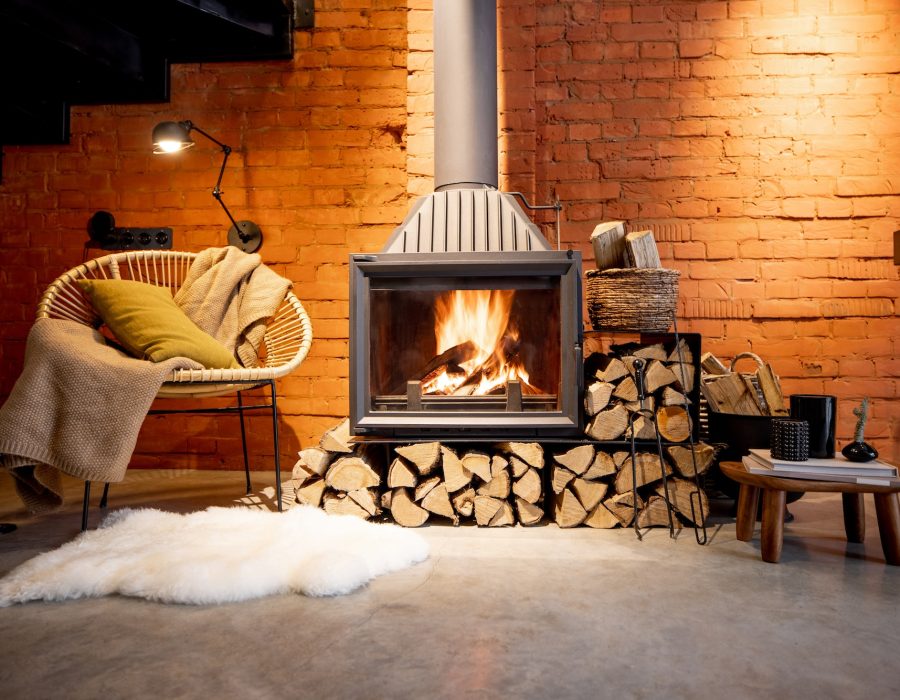 Burning fireplace with firewood at home